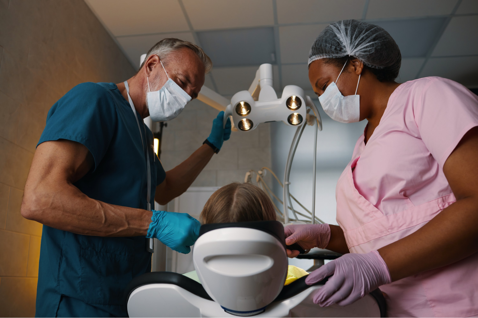 A dentist and a nurse performing a dental procedure